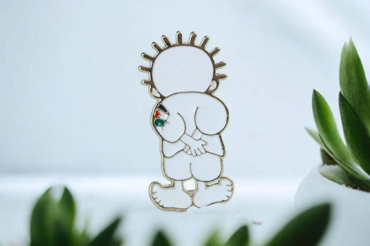 Handala Pin Badge representing Palestinian resilience and hope amidst decades of occupation, designed by artist Naji al-Ali